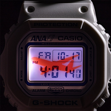 Casio G‑SHOCK x ANA DW‑5600 limited edition aviation watch with white dial, blue ANA logo, resin strap featuring airport codes, airplane LED backlight, engraved caseback, exclusive ANA packaging — available at WatchOutz.com  with secure worldwide shipping