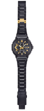 Casio G‑Shock GMC‑B2100ZE‑1A 50th Anniversary Full Metal watch, full lay out view with black finish and gold accents and bracelet details.

