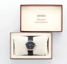 Seiko Presage Cocktail Time Series STARBAR 'Purple Sunset' Limited Edition Watch, model SRPK75 SRPK75J1 SARY239. Features a stunning purple dial inspired by the hues of a sunset cocktail, with a stainless steel case and bracelet. The watch includes elegant silver-tone hands and markers, and a see-through case back. Limited edition model, perfect for collectors and cocktail enthusiasts. Available now at Watchoutz.com: fast shipping, exceptional customer service, seamless shopping experience