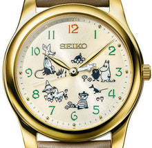 Close‑up of Seiko Moomin 2025 dial featuring Moomin characters in golden design