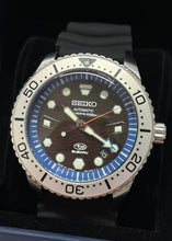 Seiko Prospex X Subaru Collaboration Automatic 200M Diver Limited Edition JDM SZEL010. Limited edition of 300 pieces. Features 200m water resistance, high-quality silicon band, JIS/ISO compliance for magnetic/shock resistance, automatic movement with 41-hour power reserve. Inspired by SUBARU’s design with blue dial, hexagon pattern, and Hawk Eye elements. Available on Watchoutz.com, best online watch shop, fast intrernational shipping, genuine products only, satisfy customers from worldwide