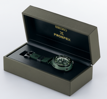 Seiko Prospex X Gundam 40th Anniversary Zaku II Mechanical Automatic Professional 1000M Diver Tuna Can SLA029 watch with a pure titanium case, ceramic shroud, and stainless steel bezel. Features include sapphire glass crystal, silicon band, and 8L35 caliber automatic movement. The watch has a 52.4mm diameter, 17.2mm thickness, and is waterproof up to 1000 meters. Limited edition, with LumiBrite coating, screw lock crown, and reverse rotation prevention bezel. Watchoutz.com. Rare Seiko. No Fake