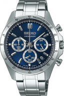 Front view of Seiko Spirit Quartz Chronograph SBTR011 with navy dial, gold accents, tachymeter scale, stainless steel case, and luminescent hands.